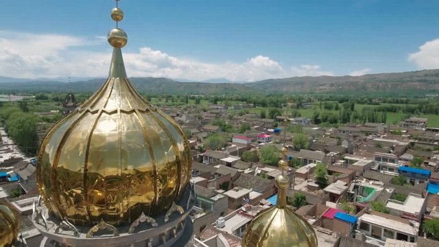 Retreating aerial footage of a small community mosque in central China