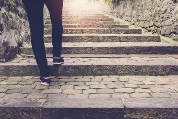 Woman walk on stair background with vintage filter