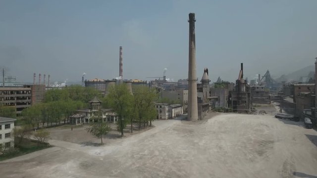 Drone shot over old pagoda reveals massive industrial complex China