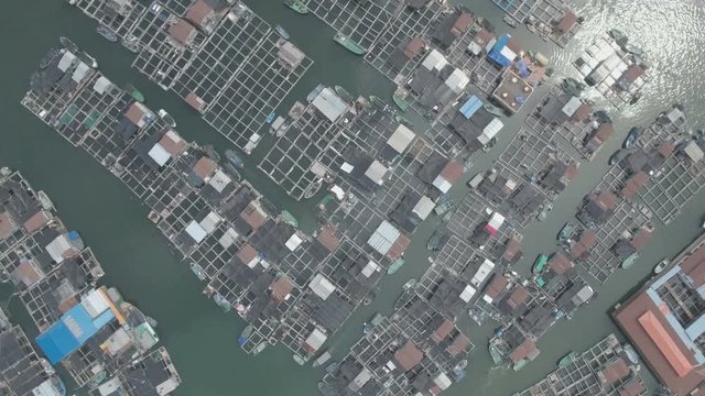 Static drone shot of a floating village on Hainan island in China