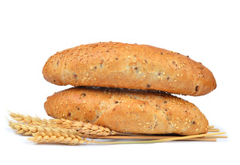 Fresh bread and wheat isolated on white background.