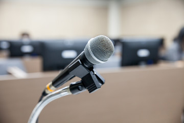 Fototapeta premium Microphone soft focus on blur abstract background lecture