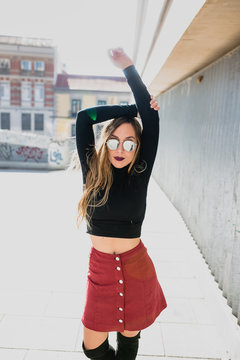 Young model posing in sunglasses.