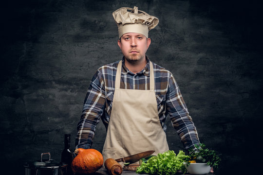 Studio Portrait Of Male Chef Preparing Healthy Salad.