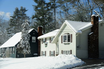 houses in residential community after snow in winter