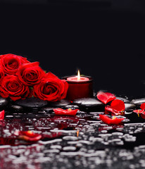 Still life with red rose with red candle and therapy stones 