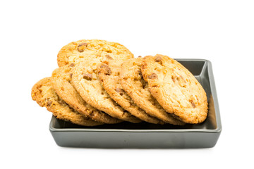 Milk chocolate almond cookies in black plate