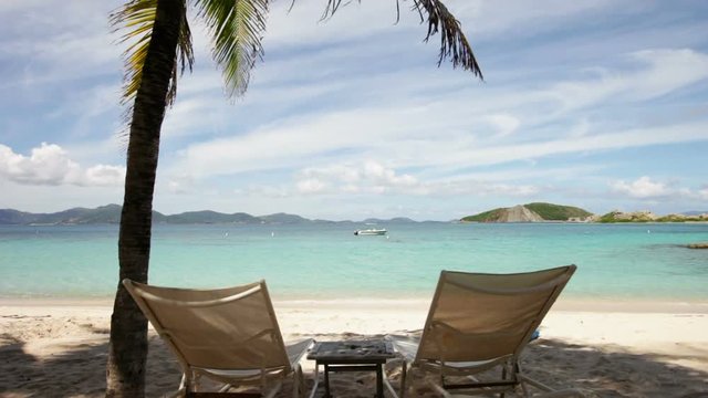 beach chairs on dead mans bay beach, Peter Island, British virgin islands