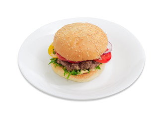 Hamburger on a white dish on a light background