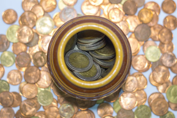 Thai coins in a jar.