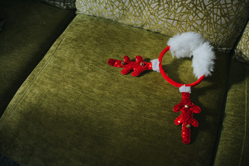 High angle view of toy deer antler on sofa