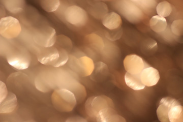 Festive beige background with bokeh effect