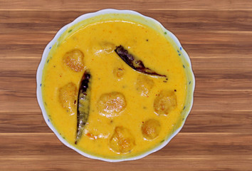 Kadhi Pakoad; Kadhi, an Indian comfort food of dumplings in yogurt sauce. Indian cuisine, Indian style food.