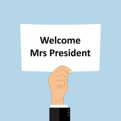 Welcome Mrs President on blank white board in hand with blue background