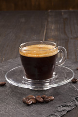 Espresso cup and coffee beans.