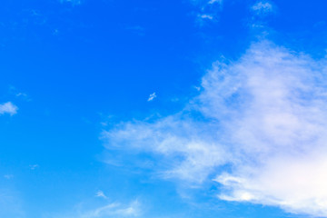Fototapeta na wymiar Blue sky background with white clouds. The vast blue sky and clouds sky on sunny day. White fluffy clouds in the blue sky.