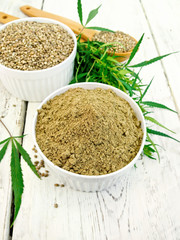 Flour hemp and grain in bowls on board