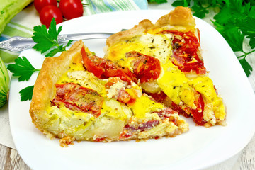 Flan with tomato and zucchini on light board