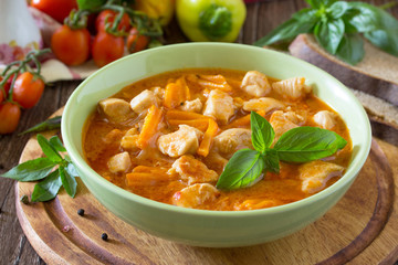 Traditional hot ragout with meat (chicken, sour cream, carrots,