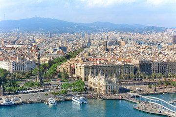 Fototapeta na wymiar Central embankment of Barcelona with Columbus statue, La Rambla street and promenade, Spain