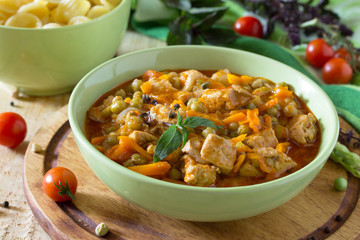 Traditional hot ragout with meat and vegetables stewed in tomato