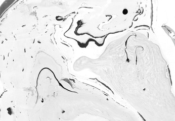 Abstract marble background. Paper and mix of flowing ink. Gray and black color mix.