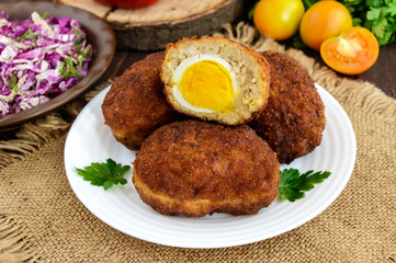 Meat mini-rolls (cutlet) with boiled egg. Close up