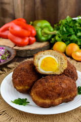 Meat mini-rolls (cutlet) with boiled egg. Close up