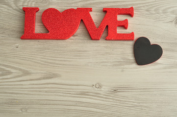 Valentine's Day. Love in red letters with a small black heart