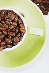 Half of green cup with coffee above view