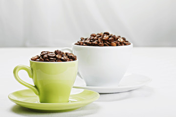 Coffee beans in different cups closeup