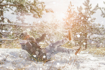 The girl photographed in a winter park, snowy forest. Snowfall.
Snow on the branches of trees. Copy space.