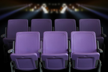 Obraz premium Empty theater auditorium or cinema with purple seats