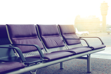 Empty chairs in the departure hall at airport