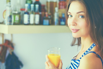 Portrait of a pretty woman holding glass with tasty juice