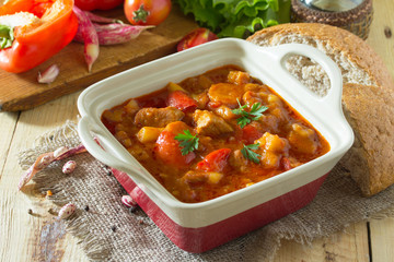 Traditional hot ragout with meat, paprika and beans, stewed in t