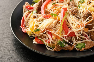 Asian salad with rice noodles, beef and vegetables.