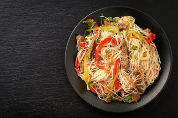 Asian salad with rice noodles, beef and vegetables.