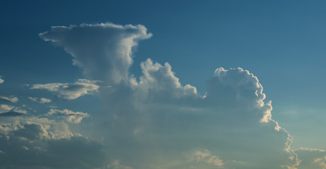 Dramatic sunset sky with clouds.