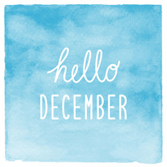 Hello December text with blue watercolor background