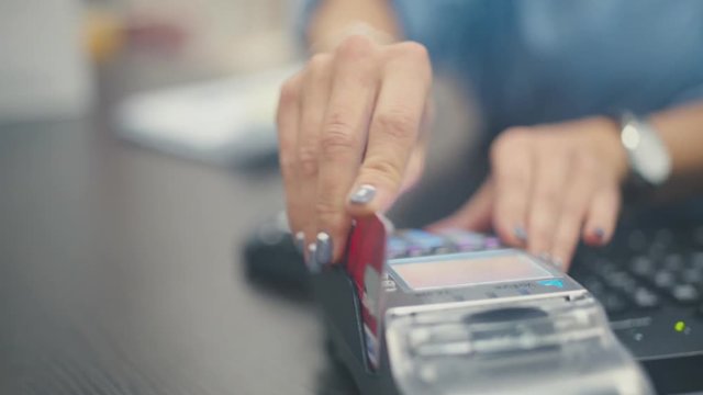 Close Up: Credit card payment terminal. Transfer payment. Payment purchases by credit card. Modern methods of purchase. Bank terminal. Banking services. Money. Payment of purchase.
