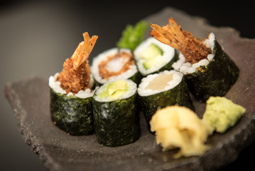 Sushi maki rolls with salmon, avocado and prawns