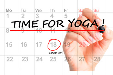 Close-up of “ Time for yoga” text on calendar