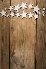 white stars on wooden table. Christmas background