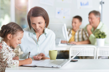 Mother with daughter do homework