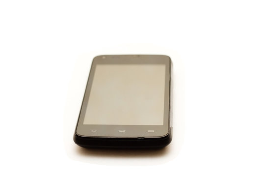 Image of smartphone laying at an angle on an isolated background