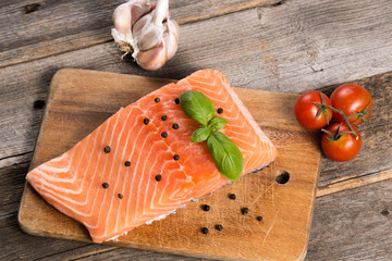 Raw salmon fillet with herbs