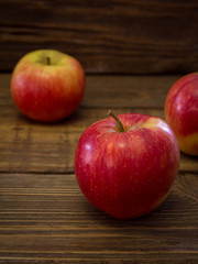 Red apples on a wooden table