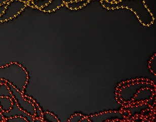 Pile of golden beads garland. Christmas beads as a background or texture. Christmas garland made...