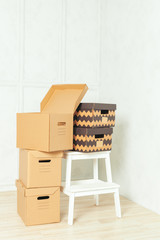 Big cardboard boxes standing insinde a room